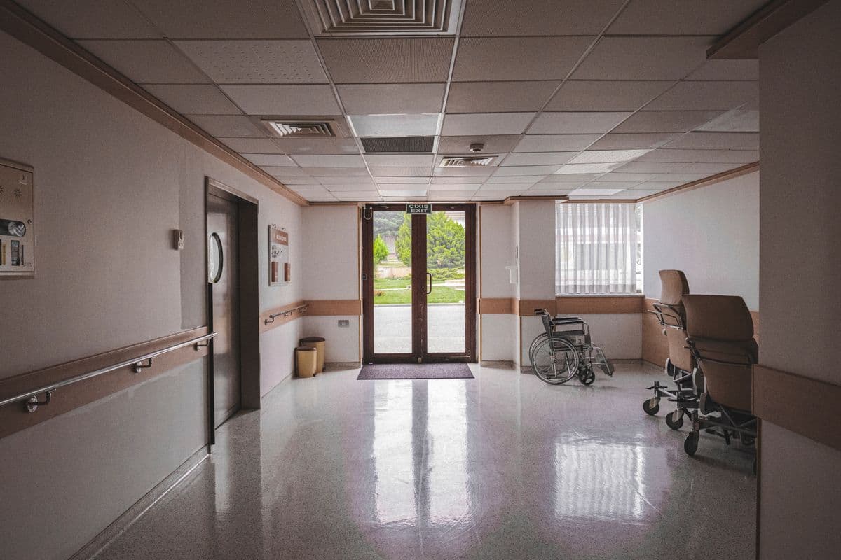 Wheelchair in a healthcare hallway